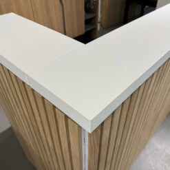 KENTO Reception Desk 180cm - White & Oak Timber Slat Acoustic(Kento Reception Desk 180cm White Oak Timber Slat Acoustic) -Modern Furniture Closeup2 1000 862119bf 699a 4e49 9b66 171329c5e6ce